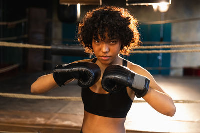 Young woman exercising in gym