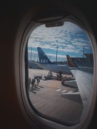 View of airport through airplane window