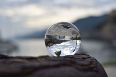 Close-up of water drop on rock in sea