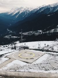 Scenic view of snow covered mountains against sky
