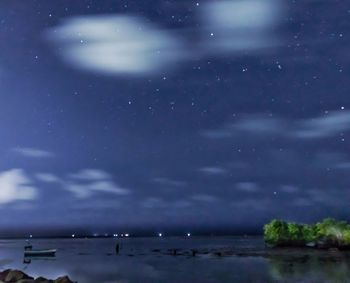 Scenic view of sea against sky at night