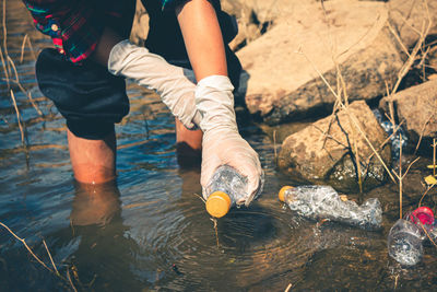 Low section of man legs in water