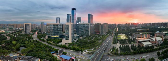 High angle view of buildings against sky during sunset