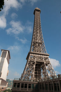 Low angle view of eiffel tower against blue sky