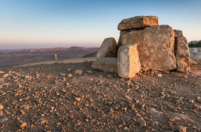 Rock formations on landscape against sky