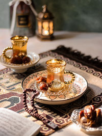 A glass of hot tea served with dates fruits in middle east vibes