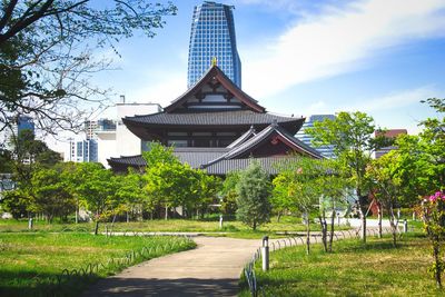 Gazebo in park against buildings