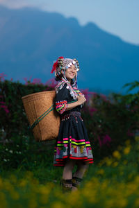 Full length of woman standing in basket