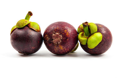 Close-up of fruits against white background