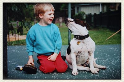 Boy looking at dog