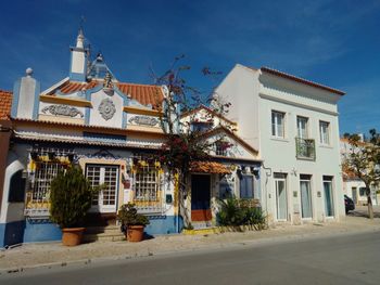 Exterior of buildings in city against sky