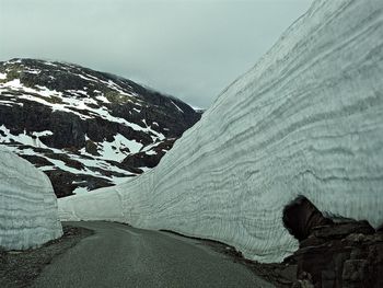 Scenic view of snow covered mountain against sky