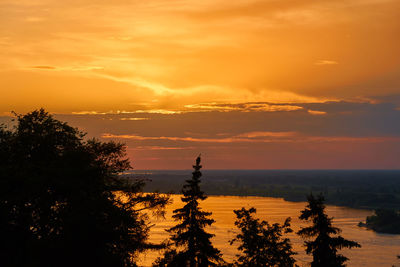 Scenic view of sea against orange sky