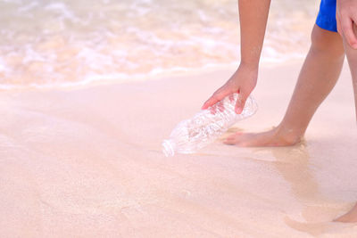 Low section of child on beach