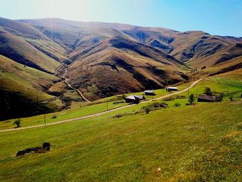 Scenic view of landscape and mountains against sky