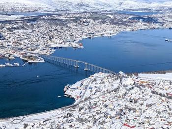 View of the bridge to tromso island, norway, in winter with snow seen from above
