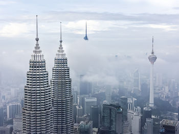 Modern buildings in city against sky