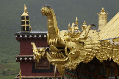 Low angle view of statue against temple