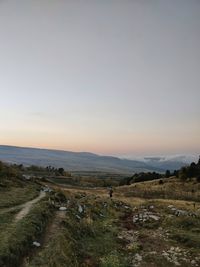 Scenic view of field against sky during sunset