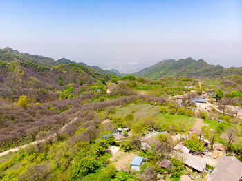 High angle view of townscape and mountains against sky