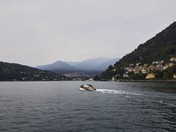 Scenic view of sea against mountains