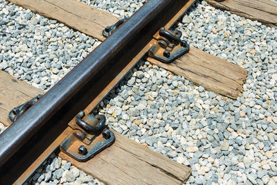 High angle view of stones on railroad track