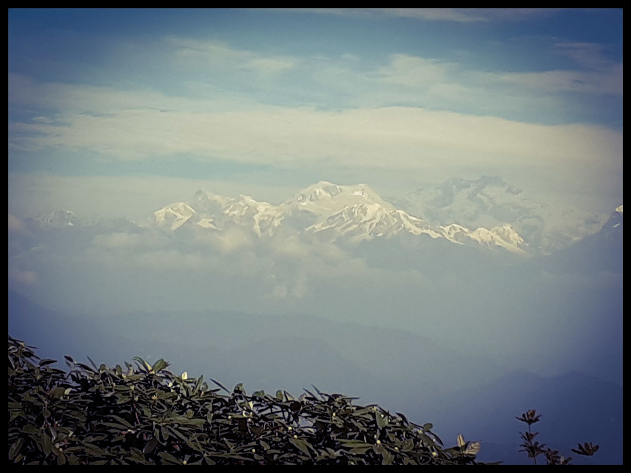 PANORAMIC VIEW OF SNOWCAPPED MOUNTAINS AGAINST SKY