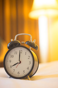 Close-up of clock on table