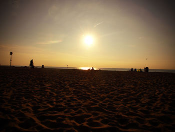 View of calm beach at sunset