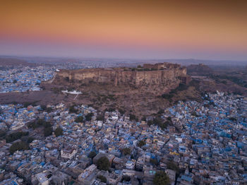 High angle view of townscape against sky during sunset