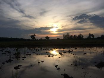 Scenic view of lake at sunset