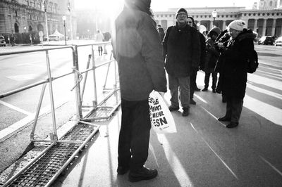 People walking on railroad station platform