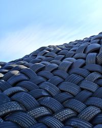 Heap of tires against blue sky