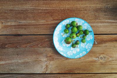 High angle view of vegetables in plate on table