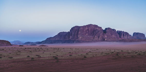 Scenic view of desert against clear sky