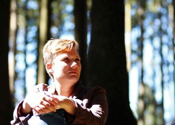 Close-up of young man in forest