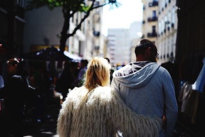 Rear view of a couple walking outdoors