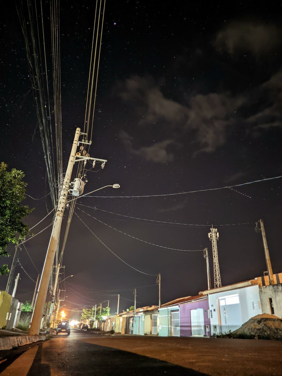 night, sky, light, architecture, star, long exposure, electricity, nature, illuminated, cable, transportation, technology, built structure, no people, power generation, darkness, space, cloud, road, city, street, motion, outdoors, science, astronomy, industry, electricity pylon, building exterior, power line