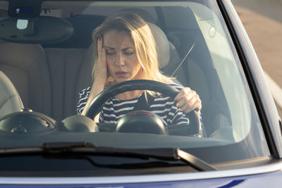 Woman sitting in car