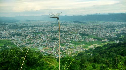 Scenic view of landscape against sky in city