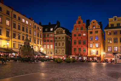 Buildings in city at night