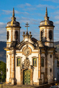 Facade of historic building against sky