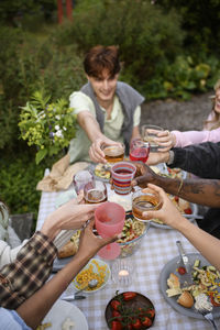 Portrait of woman having food at park