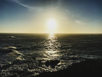 Scenic view of sea against clear sky during sunset