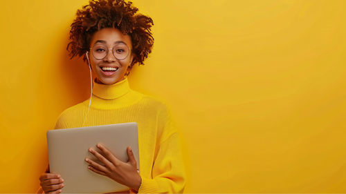 Portrait of young woman using mobile phone