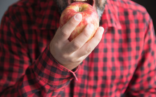 Close up of man eating an apple