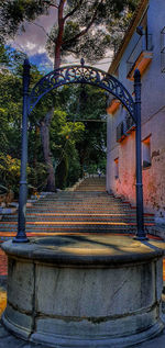 Low angle view of staircase in park against building