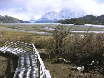 Scenic view of lake and mountains against sky