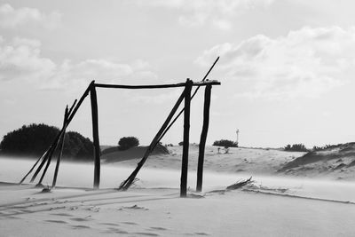 Scenic view of beach against sky during winter