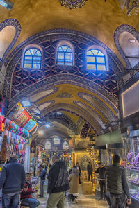 People at illuminated market stall